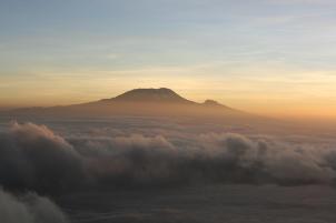 Dawn over Kilimanjaro from Rhino Point on Mount Meru summit ridge